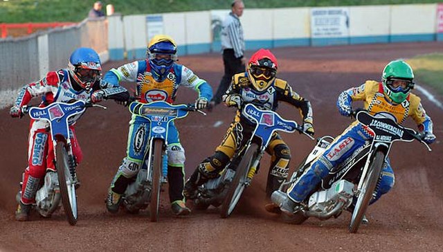 All 4 riders leaning into the first corner – note the elbows.