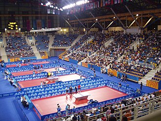 Interior view of the Galatsi Olympic Hall, during the 2004 Summer Olympics. TableTennisAt2004SummerOlympics-1.jpg