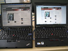 Photograph showing open X61 and X200s sitting side by side