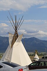 Tipi and Mission Mountains at 2015 Arlee Celebration Pow Wow.JPG