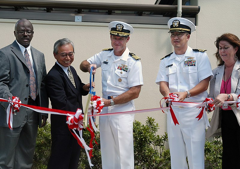 File:US Navy 070822-N-0807W-049 Capt. Tilghman D. Payne, commander of Fleet Activities Sasebo, and Mr. Tsuyoshi Oishi, Chief of Sasebo Defense Facilities Administration Office, cut the ceremonial ribbon at the grand opening of Fiddl.jpg