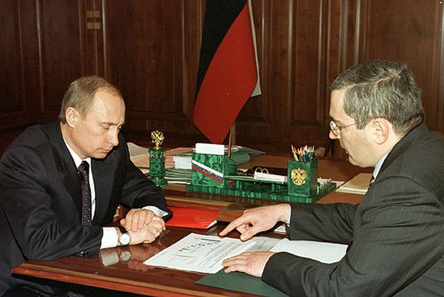 Putin (left), with Mikhail Khodorkovsky (right) in December 2002. Mikhail Khodorkovsky was jailed the following year.
