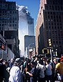 The North Tower burning behind WTC 7.