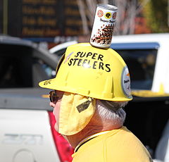 A Pittsburgh Steelers fan with a can of Iron City on his head