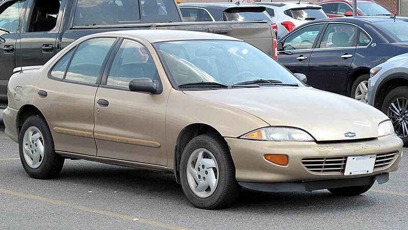 File:1999 Chevrolet Cavalier VL in Medium Sunset Gold Metallic, Front Right, 07-17-2022.jpg