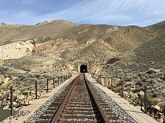 Western portal of the Carlin Tunnel 2015-04-19 14 54 17 Western portal of the northern rail line through the Carlin Tunnel in Elko County, Nevada.jpg