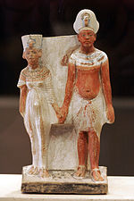 Painted statues of the ruler Akhenaten and Queen Nefertiti (1345 BC)