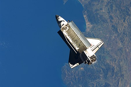 "Seen over the Mediterranean Sea, near the Algerian coast, the space shuttle Atlantis is featured in this image photographed by the Expedition 21 crew on the International Space Station soon after the shuttle and station began their post-undocking separation. Undocking of the two spacecraft occurred at 3:53 a.m. (CST) on Nov. 25, 2009."