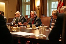 Flanked by Michael Chertoff, Secretary of Homeland Security, left, and Secretary of Defense Donald Rumsfeld, President Bush meets with members of the Task Force on Hurricane Katrina Recovery on August 31, 2005. BUSHLA.jpg