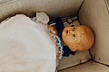 Baby doll in a cradle (Unsplash).jpg