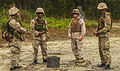 Bermudan soldiers with Guns and Assault Platoon, and a U.S. Marine with 2nd Combat Engineering Battalion, discuss training after they complete a wired connection on Marine Corps Base Camp Lejeune, N.C., May 2 130502-M-BW898-002.jpg