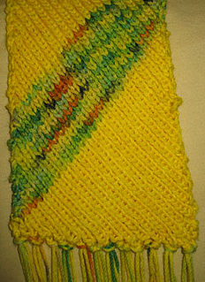 Bias knitting technique of skewing the grain of a knitted fabric by decreasing on one side and increasing on the other