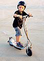 Boy on electric scooter 5988226382 e289654724 z.jpg