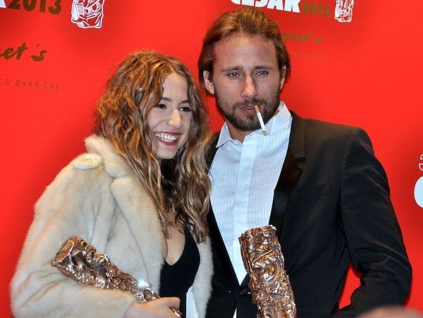 Schoenaerts holding his award at the 2013 César Awards ceremony.