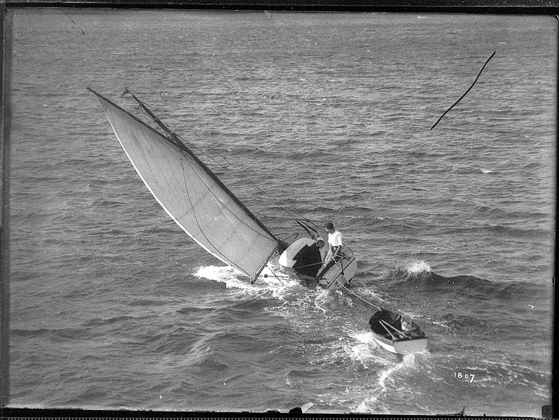 File:Couple in a sailboat with dinghy (7154301273).jpg