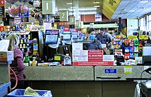 Glass shields such as these were installed to protect employees and customers at grocery store checkout counters. Dangerous Duty.jpg