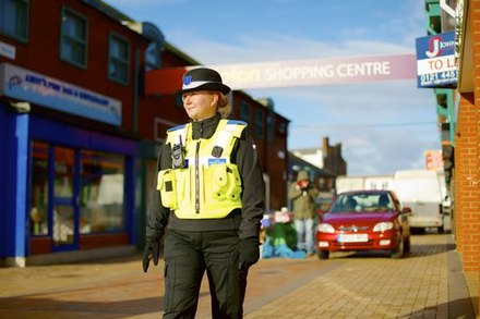 A Police Community Support Officer of West Midlands Police on foot patrol