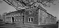 The old estate offices and stables built from the masonry of the old abbot's dwelling Eglinton castle offices and stables.jpg