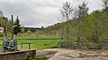 Ehemaliges Betriebsgelände mit neuer Bepflanzung nach dem Abriss 2009: Im Vordergrund ein Wehr des Wernesbaches