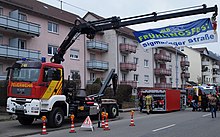 A Feuerwehr Wechselladerfahrzeug crane with deployed pumping roller container Feuerwehr Albstadt 1-65.jpg