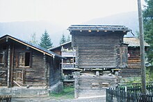 Barn on a wooden cellar in Gluringen, Valais, Switzerland. Traces in the ground would appear as a "pit-house". Gluringen Scheunen.jpg