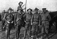 Karl Linderfelt, center. Original photo caption: "OFFICERS OF THE COLORADO NATIONAL GUARD From left to right: Captain R. J. Linderfelt, Lieut. T. C. Linderfelt, Lieut. K. E. Linderfelt, (who faced the charge of assault upon Louis Tikas, the dead strike leader), Lieut. G.S. Lawrence and Major Patrick Hamrock. The last three were in the Ludlow battle of April 20, 1914." Karl linderfelt.jpg