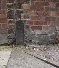 Boundary marker on Seymour Road. Note paving to the east (ex-Tottenham), tarmac to the west (ex-Hornsey) MBH - MBT Boundary Marker.jpg