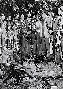 MNLF fighters surrender their firearms to President Ferdinand Marcos.