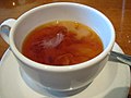 A cup of Orange Pekoe tea with milk.