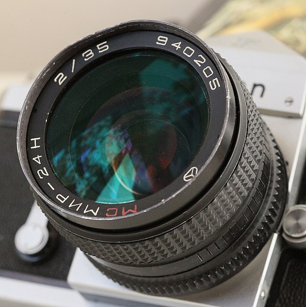Мир 20 цена. Canon FD 28 3 5. Широкоугольный объектив «мир-м20»,. Просветление оптики. Просветление оптики в объективе.