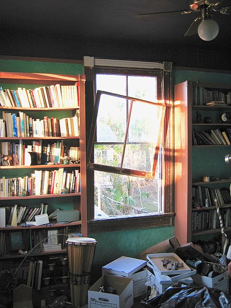 Upstairs library room in home where downstairs flooded Lakeview neighborhood. Hurricane winds blew out window, but left books in shelves