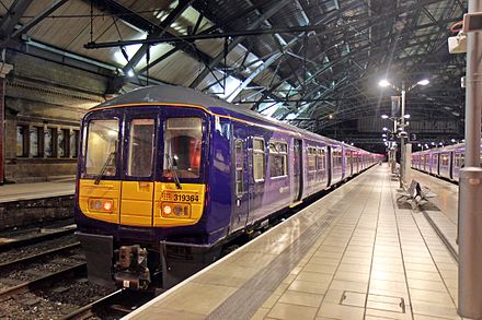 A Class 319 at former Platform 2. The new electric services to Manchester Victoria and Wigan North Western were both officially timetabled from 17 May 2015