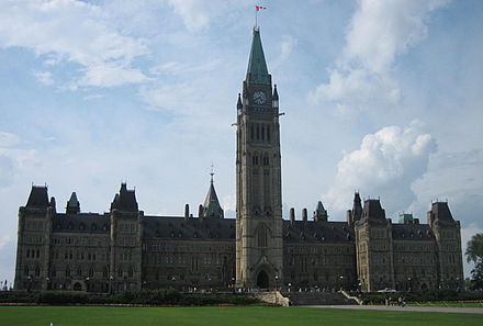 The Peace Tower and Centre Block of the Canadian Parliament where Canada's elected representatives meet to debate and vote on laws.  Located on Parliament Hill in central Ottawa, Ontario.