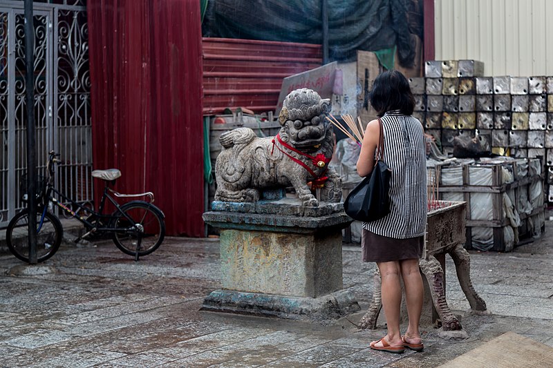 File:Penang Malaysia Woman-praying-in Kuan-Yin-Temple-at-a-rainy-day-01.jpg