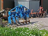 Picture of a collection of plows on a barnyard in Laaghalerveen - Netherlands, Spring 2012; photo, Fons Heijnsbroek