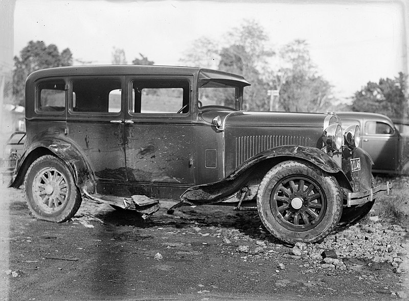 File:Side view of a beaten up automobile (AM 75733-1).jpg