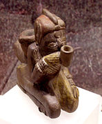 Effigy pipe of a man smoking a pipe, Missouri flint clay