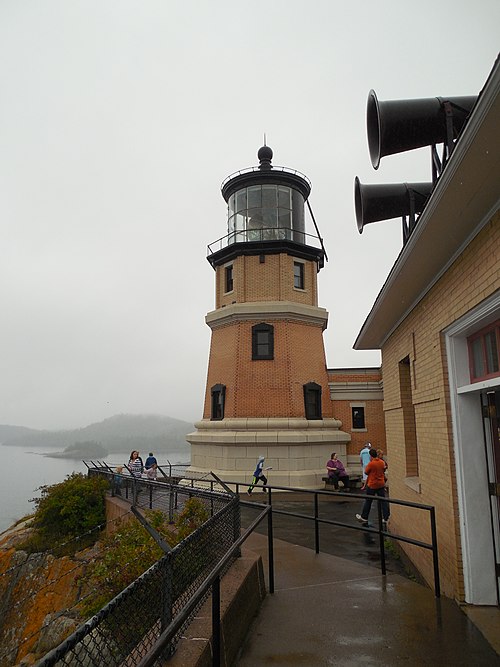 Visitors at Split Rock Lighthouse. Fog Horn House in the foreground.