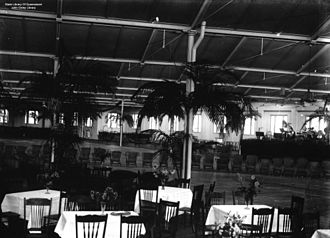 Set up for the vice-regal ball held in honour of the visiting Duke and Duchess of York, 1927 StateLibQld 1 73649 Tables and chairs set up in the woolstore at New Farm, Brisbane, for the Vice-regal ball held in honour of the visiting Duke and Duchess of York, 1927.jpg