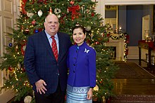 Hogan with his wife Yumi in 2018 State Employees Open House (46273476621).jpg