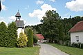 Čeština: Vesnice Vlkov, část obce Stvolová v okrese Blansko. Průhled ulicí od západu směrem k návsi, vlevo kaple sv. Cyrila a Metoděje.