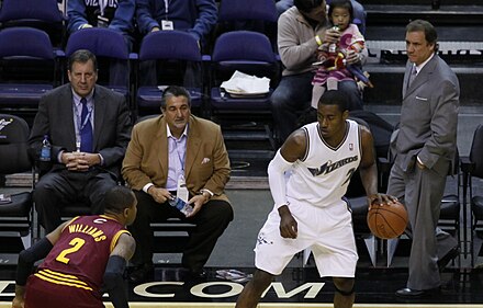 Owner Ted Leonsis and then coach Flip Saunders watch John Wall in 2010.