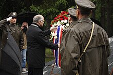 Josip Leko, then-Speaker of the Croatian Parliament, lays a wreath at the Tezno Memorial in May 2015 Tezno commemoration 2015.jpg