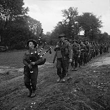 The 2nd Battalion, led by their piper, advance during Operation Epsom in Normandy in June 1944. The British Army in Normandy 1944 B5988.jpg
