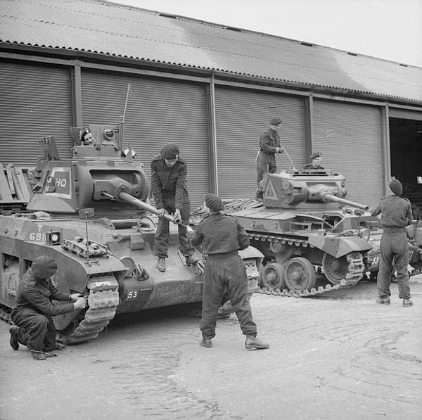 A Matilda tank and a Valentine of the 40th (The King's) Royal Tank Regiment being 'bulled up' at Crowborough in Sussex for a 'Speed the Tanks' parade 