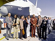 In 1976, a letter-writing campaign compelled NASA to name the inaugural (and test) Space Shuttle Enterprise after the fictional starship. In this image, Enterprise is rolled out of the Palmdale manufacturing facilities with Star Trek television cast members and creator Gene Roddenberry in attendance. The Shuttle Enterprise - GPN-2000-001363.jpg