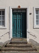Portal of historical building (1713) Krahnenstraße 38 in Trier, Germany.