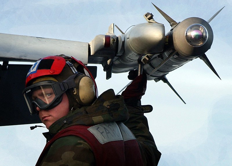 File:US Navy 041102-N-5345W-096 Aviation Ordnanceman Airman Christopher Walker prepares to pull the arming pin on an AIM-9X Sidewinder air-to-air missile.jpg