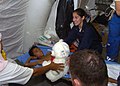 US Navy 050106-N-9593M-054 Hospital Corpsman 3rd Class Sylvia Esthay of Lake Charles, La., presents a teddy bear to a young Indonesia boy.jpg