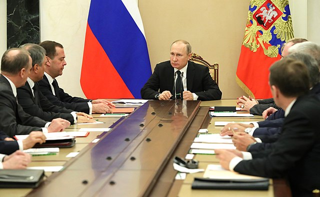 President Putin and members at a security council meeting on 30 March 2018.